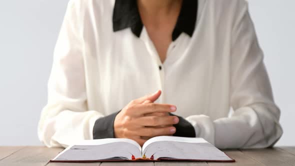 Blind woman reading a braille book