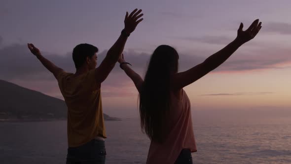 Young couple enjoying the sunset view