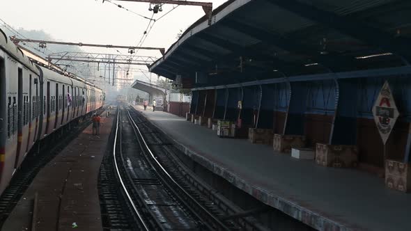 Train slowly driving through the train station in Mumbai.