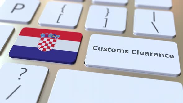 CUSTOMS CLEARANCE Text and Flag of Croatia on the Computer Keyboard