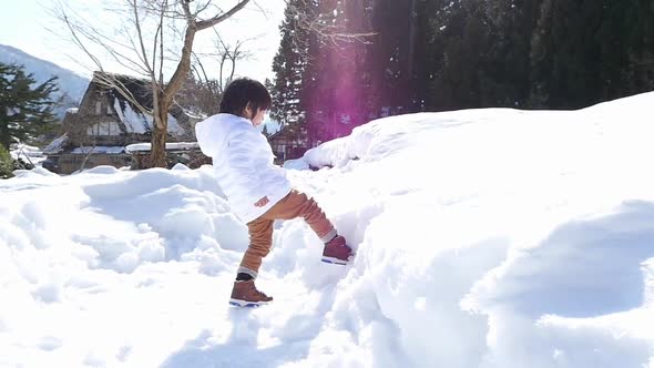 Cute Asian Child Playing Snow Outdoors Slow Motion