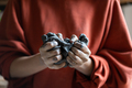 Close-up of woman hands in red sweater kneading sculptural clay intended for making figurines - PhotoDune Item for Sale