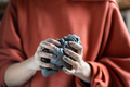Woman holding piece of clay while visiting pottery master class, learning how to make ceramics - PhotoDune Item for Sale