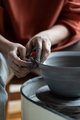 Artisan woman hands shaping deep plate made of natural clay placed on spinning potter whee - PhotoDune Item for Sale