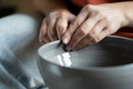 Stress-relieving hobbies, female hands molding wet clay on wheel - PhotoDune Item for Sale