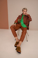 Mature fashion woman short haircut in fashionable clothes, plaid jacket, color shirt, leather pants - PhotoDune Item for Sale