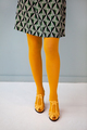 Colorful yellow tights with fashionable mules sandals and mini skirt. Legs of stylish woman - PhotoDune Item for Sale