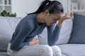 Woman suffering from strong abdominal pain - PhotoDune Item for Sale