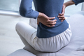 Female with back pain at home - PhotoDune Item for Sale