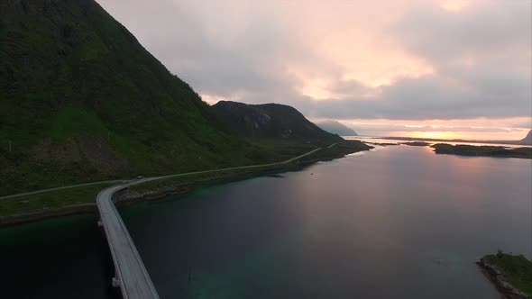 Flying over bridge during sunset