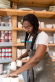 Woman with braided hair at her home art ceramics studio - PhotoDune Item for Sale