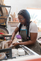 Woman washing her pottery at the ceramics studio - PhotoDune Item for Sale
