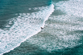 Aerial view of surfers surfing waves in Beach of Antuerta in Ajo - PhotoDune Item for Sale