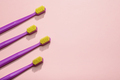 Modern purple kids toothbrushes on a pink background. Copy space for your text, - PhotoDune Item for Sale