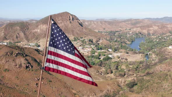 USA Flag on a Flagpole.  Aerial of the American Flag Is Blowing on a Wind