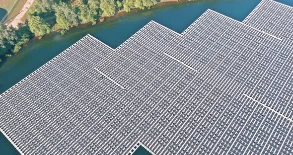 Aerial View of Floating Solar Panels Platform on Lake