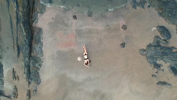 Aerial Drone View of Young Woman on Beach Top Above