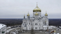 Aerial view of a white church with golden domes on a winter cold day. Clip. Concept of religion and - PhotoDune Item for Sale