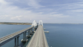 Aerial breathtaking view of the turquoise sea and a long white bridge with arcuate shape. Shot - PhotoDune Item for Sale