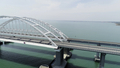 Aerial breathtaking view of the turquoise sea and a long white bridge with arcuate shape. Shot - PhotoDune Item for Sale