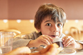elementary age kid boy with chocolate moustache drinking hot chocolate - PhotoDune Item for Sale