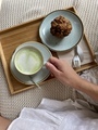 Hand holding cup with matcha latte and muffin - PhotoDune Item for Sale