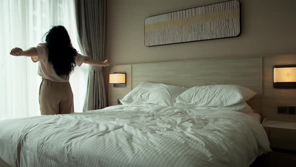 Exhausted or Bored Sleepy Woman Stands at Window Then Collapses on Bed Exhausted