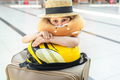 Funny suitcase,bag.Girl in airport terminal. Travel head neck airplane pillow.Boarding to  - PhotoDune Item for Sale