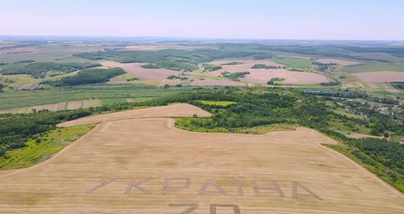 Tractor Plowed The Inscription In The Field  Ukraine