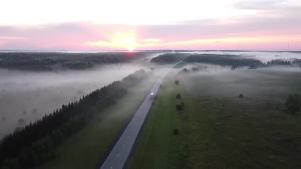 Top View of the Highway in the Fog at Sunset