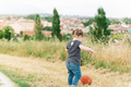 Baby girl playing ball in a field - PhotoDune Item for Sale