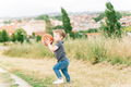 Baby girl playing with a ball in a field - PhotoDune Item for Sale