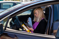 middle aged blonde business woman in glasses in car working with documents - PhotoDune Item for Sale