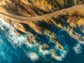 Aerial view of road, rocky sea coast with waves at sunset - PhotoDune Item for Sale