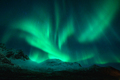 Northern lights over the snowy mountains at night in Norway - PhotoDune Item for Sale