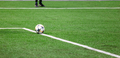 Soccer ball in the grass of the football field - PhotoDune Item for Sale
