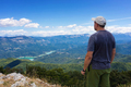 Mountain explorer observes the landscape on the horizon - PhotoDune Item for Sale
