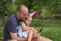A father and his little daughter communicate by video using a smartphone - PhotoDune Item for Sale