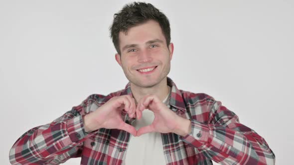 Portrait of Young Man Showing Heart Shape By Hands