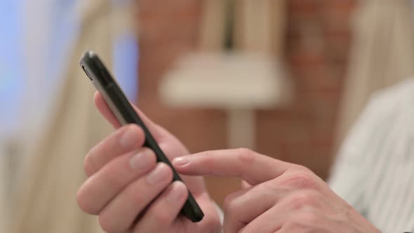 Portrait of Middle Aged Man using Smartphone