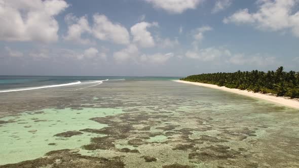 Drone footage of the surf and reef at Cocos Island