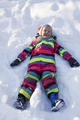 Cheerful child lying on snow - PhotoDune Item for Sale