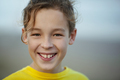 Portrait of a happy boy with curly hair outdoors - PhotoDune Item for Sale
