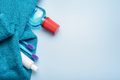 Toothbrushes with paste tube, towel and mouthwash bottle on blue background. - PhotoDune Item for Sale