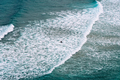 Aerial view of surfers surfing waves in Beach of Antuerta in Ajo - PhotoDune Item for Sale