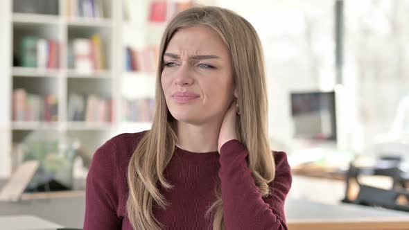 Portrait of Exhausted Young Woman with Neck Pain