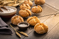 Homemade spelt bread rolls with salt on wooden background - PhotoDune Item for Sale
