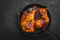 Roasted half chicken in pan on black background - PhotoDune Item for Sale