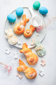 Easter baking - Buns made from yeast dough in a shape of Easter bunny and colored eggs - PhotoDune Item for Sale