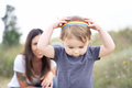 Little girl playing with a lgbt headband outdoors - PhotoDune Item for Sale